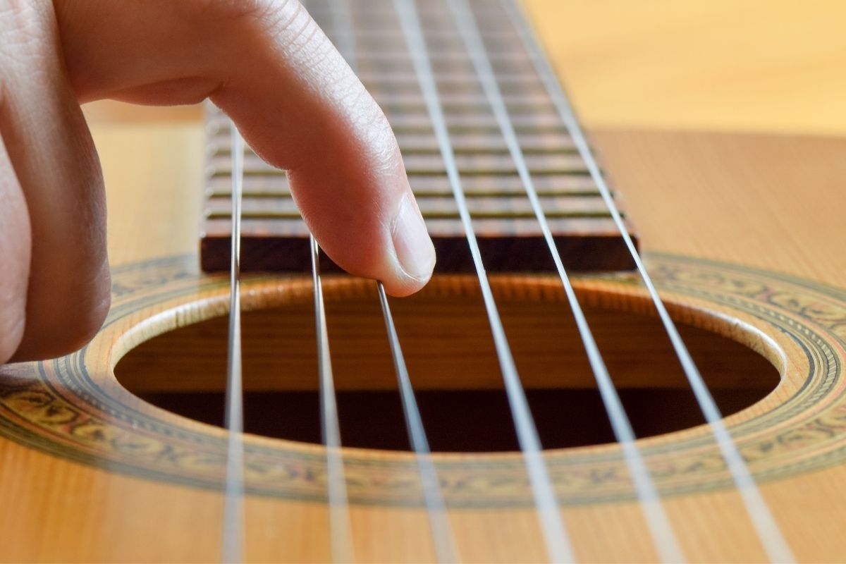 how to fix fret buzz on acoustic guitar